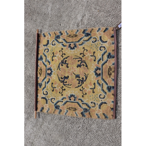 133 - A Chinese Ningxia meditation mat with floral design on a beige ground, 68 by 70cms.