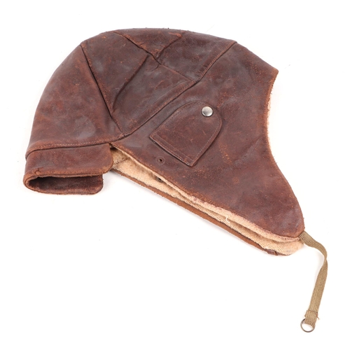 108 - A brown leather Flying or Driving helmet with elasticated chin strap. No makers name.