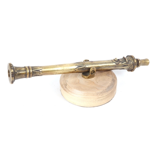 109 - A cast brass Lantaka Cannon mounted on a hardwood base. Overall barrel length 44cms (17.25ins) with ... 