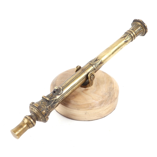 109 - A cast brass Lantaka Cannon mounted on a hardwood base. Overall barrel length 44cms (17.25ins) with ... 