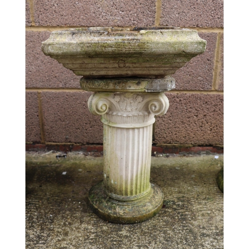 11 - A well weathered  stoneware bird bath, 50cm high.