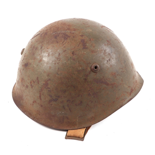 132 - A WWII Italian army M33 steel combat helmet, with leather liner and chin strap.