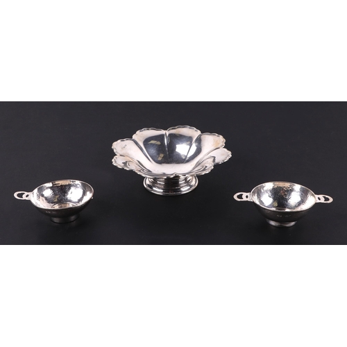 492A - A pair of beaten silver Quaich's (one with missing handle), Birmingham 1923, together with a mid cen... 