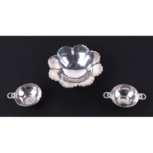 492A - A pair of beaten silver Quaich's (one with missing handle), Birmingham 1923, together with a mid cen... 