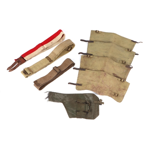 144 - Assorted militaria including WWI leather gaiters, a Sam Browne belt, a canvas belts, a bee can, a Br... 