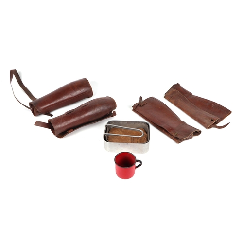 144 - Assorted militaria including WWI leather gaiters, a Sam Browne belt, a canvas belts, a bee can, a Br... 