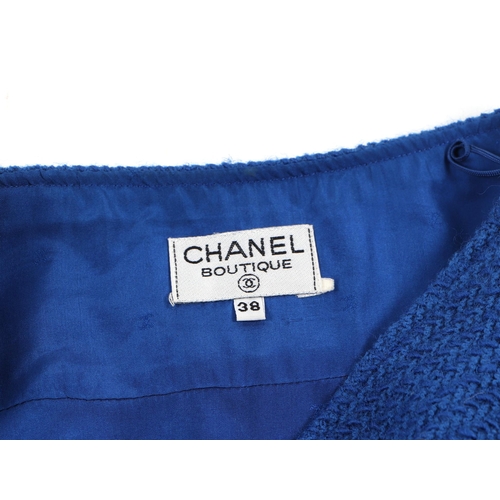 153 - A vintage Chanel bouquet blue skirt with three brass buttons, together with a Louis Vuitton pale blu... 