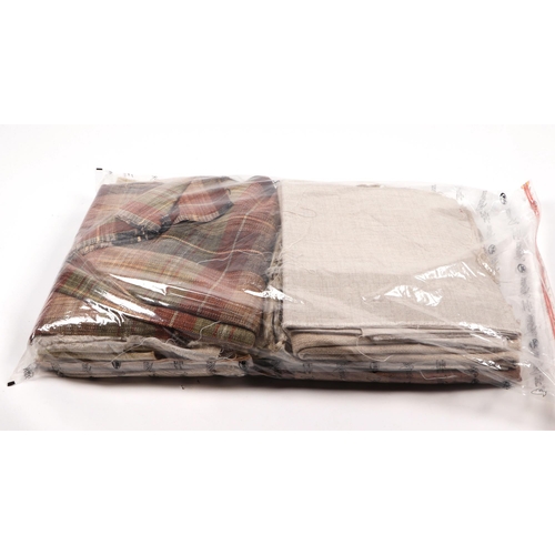 157 - A quantity of upholsterers fabric remnants, to include cashmere and tartan. (We recommend personal i... 