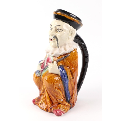 285 - A French pottery water jug, in the form of a seated Oriental gentleman, signed F Perrot and No.395 t... 