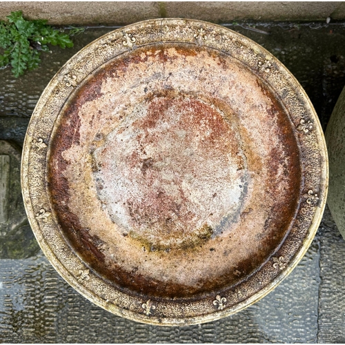 3 - A well weathered stoneware bird bath, 60cm high.