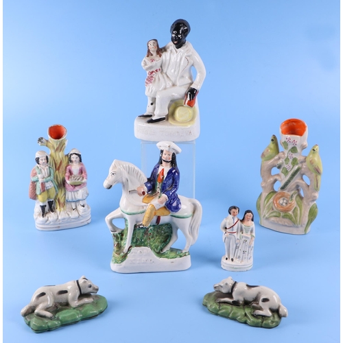 314 - A group of 19th century Staffordshire figures, to include Dick Turpin, 22cm high, a pair of recumben... 