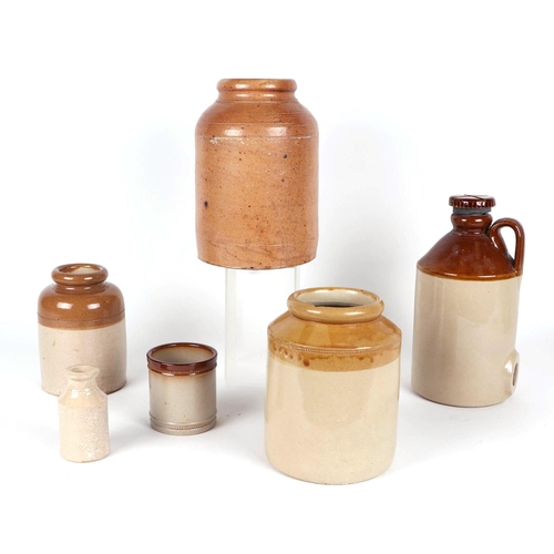 317 - A quantity of stoneware jars and flagons (12).