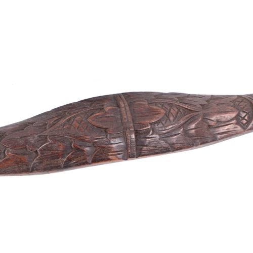 325 - Two carved hardwood shoulder yokes, possibly Indonesian, 135cm and 134cm long (2).