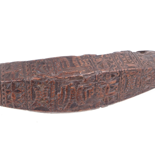 325 - Two carved hardwood shoulder yokes, possibly Indonesian, 135cm and 134cm long (2).