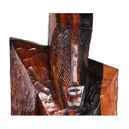 329 - Ben Osawe (Nigerian 1931-2007) A carved hard wood totem figure, signed and dated 1970, 82cm high.