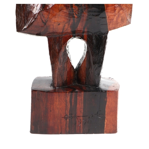 329 - Ben Osawe (Nigerian 1931-2007) A carved hard wood totem figure, signed and dated 1970, 82cm high.