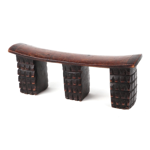 337 - An African Tribal carved hardwood neck/head rest, 41cm wide.