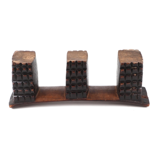 337 - An African Tribal carved hardwood neck/head rest, 41cm wide.