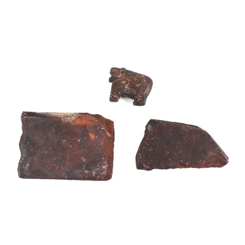 338 - After the antique: two South American pottery tile fragments, with moulded decoration in the form of... 