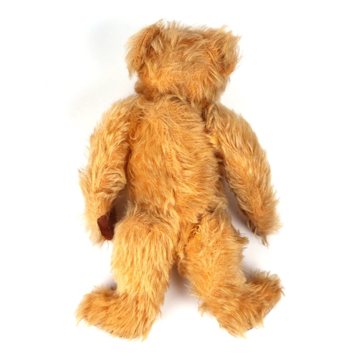 356 - A vintage plush teddy bear, 20cm high.