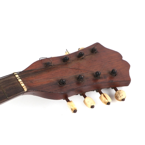 357 - An Italian mandolin, with mother of pearl inlaid decoration, 60cm long.