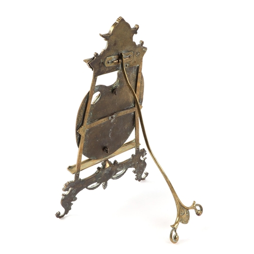 372 - A brass strut table top picture frame, in the form of an easel with artiest pallet, 42cm high.