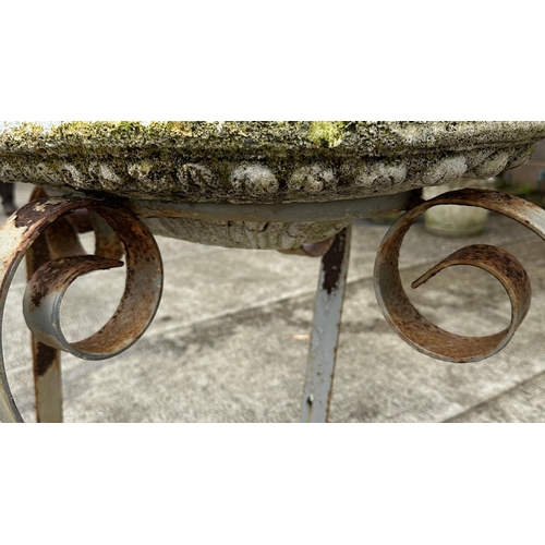 39 - A wrought iron garden table base, 68cm high, approx 111cm wide.