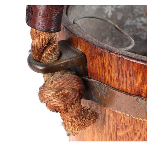 397 - A 19th century copper bound oak peat or fire bucket, with Royal Coat of Arms and original leather bo... 