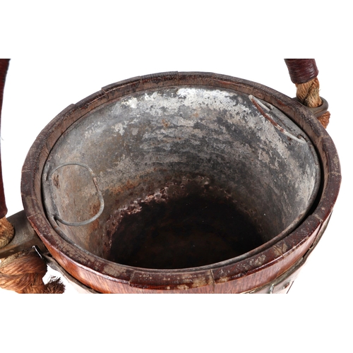 397 - A 19th century copper bound oak peat or fire bucket, with Royal Coat of Arms and original leather bo... 