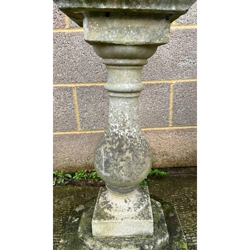 4 - A well weathered stoneware garden sun dial, 72cm high.