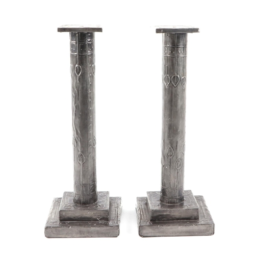 406 - A pair of Art Nouveau style candle sticks, with stepped square bases, 30cm (2).