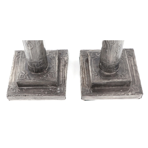 406 - A pair of Art Nouveau style candle sticks, with stepped square bases, 30cm (2).