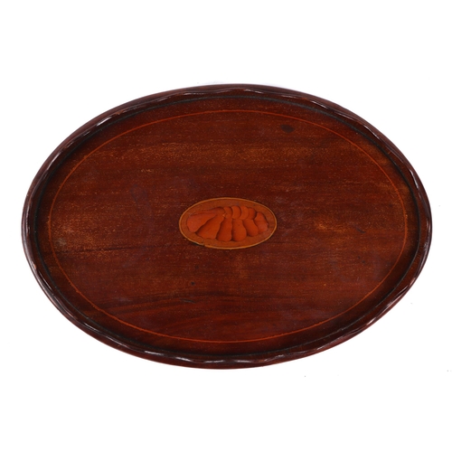 408 - An Edwardian oval inlaid mahogany card tray, with central shell motif, 30cm wide.