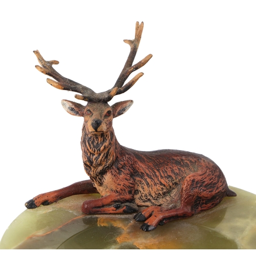 418 - An early 20th century cold painted bronze figure of a red deer, on a green onyx ashtray base, 12cm d... 