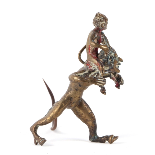 420 - A cold painted bronze group, depicting a small devil riding the shoulders of a larger devil, 7cm hig... 