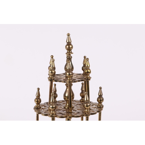 421 - A cast brass three tier cotton reel stand, 32cm high.