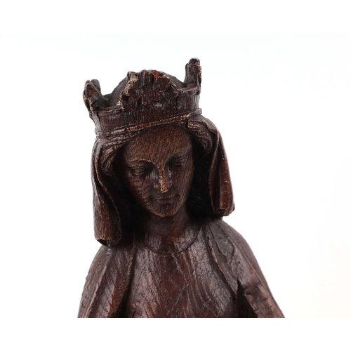 427 - An 18th century style faux oak figural group, depicting the Madonna and Child, 42cm high.