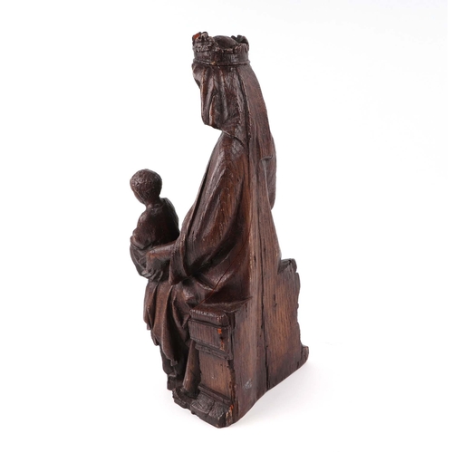 427 - An 18th century style faux oak figural group, depicting the Madonna and Child, 42cm high.