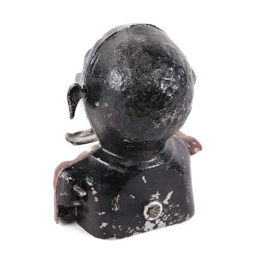 438 - A vintage painted aluminium articulated money box, in the form of a black man,12cm wide.