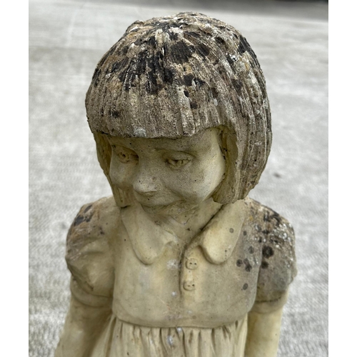 44 - A well weathered stoneware garden ornament, depicting a young girl holding a barrel, 83cm high.