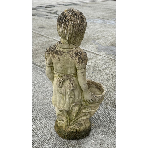 44 - A well weathered stoneware garden ornament, depicting a young girl holding a barrel, 83cm high.