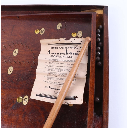 452 - A vintage bagatelle board, together with two oak biscuit barrels (3).