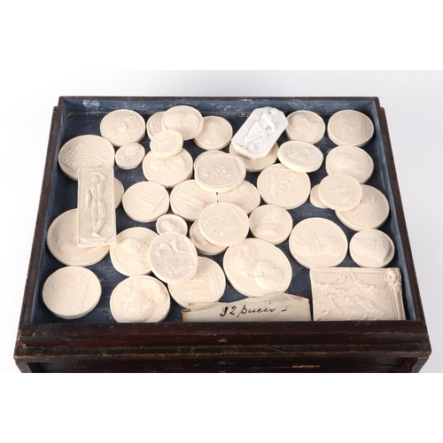 459 - A large collection of 19th century Grand Tour style plaster seal intaglio casts, after the Antique, ... 