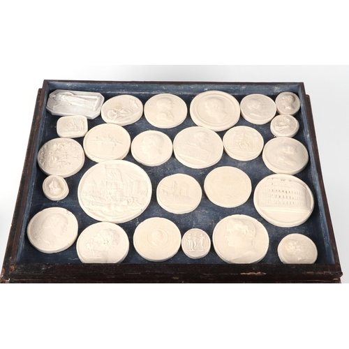 459 - A large collection of 19th century Grand Tour style plaster seal intaglio casts, after the Antique, ... 