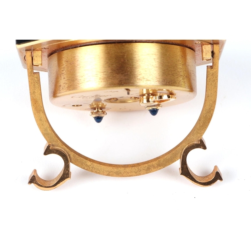 463 - A Cartier gilt metal and black enamel table alarm clock, the white dial with Roman numerals, number ... 