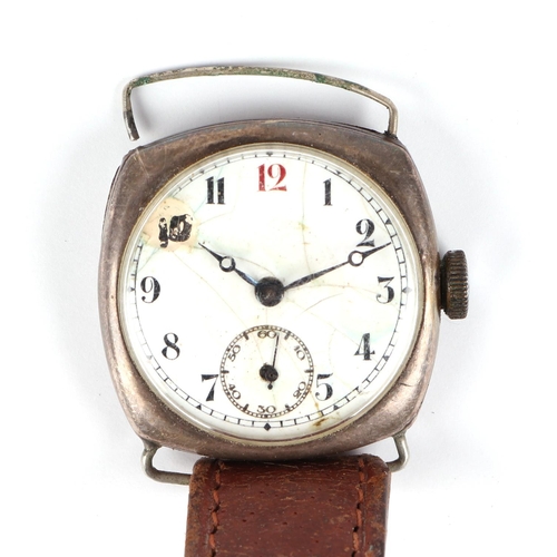 467 - A silver cased trench watch, the white enamel dial with Roman numerals and subsidiary seconds.