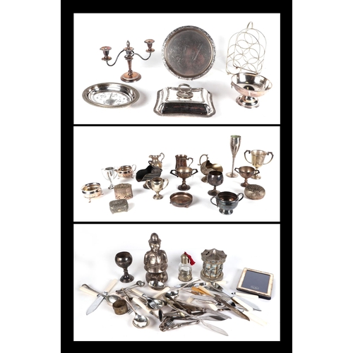 475 - A quantity of silver plated items, including trophy cups, tankers, entrée dishes and other items.