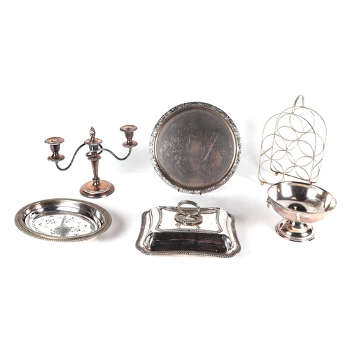 475 - A quantity of silver plated items, including trophy cups, tankers, entrée dishes and other items.