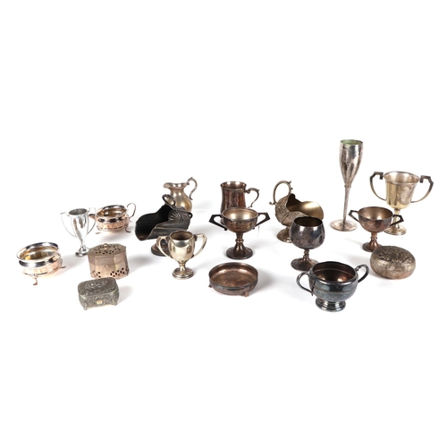 475 - A quantity of silver plated items, including trophy cups, tankers, entrée dishes and other items.