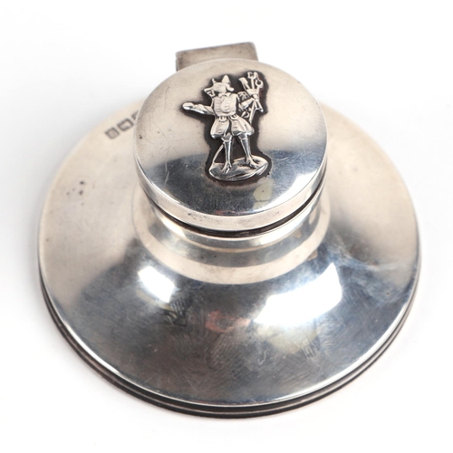 476 - An early 20th century silver capstan, silver inkwell, Birmingham 1915, the top decorated 